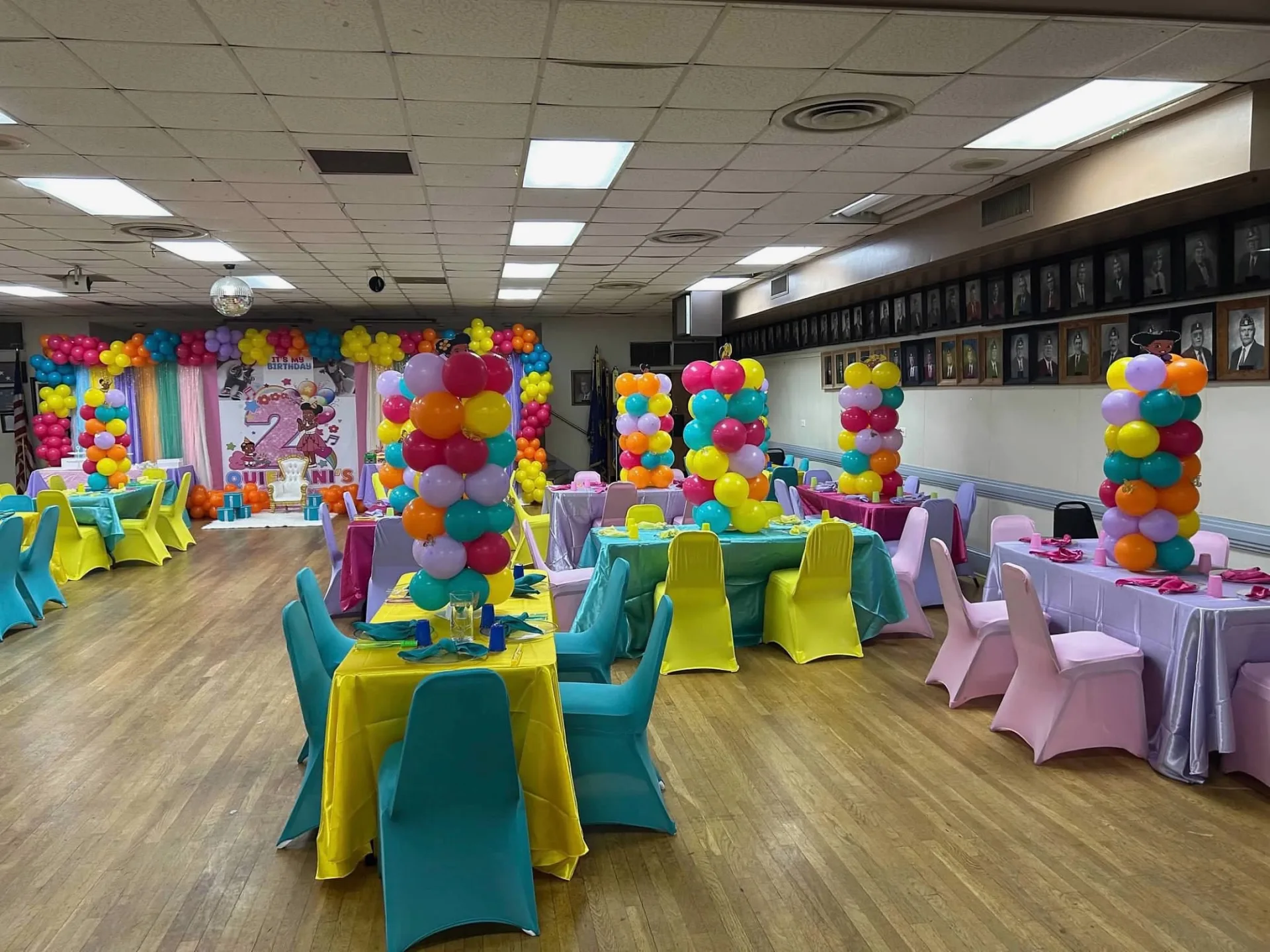 Wide view of the colorful second birthday room and balloon installations