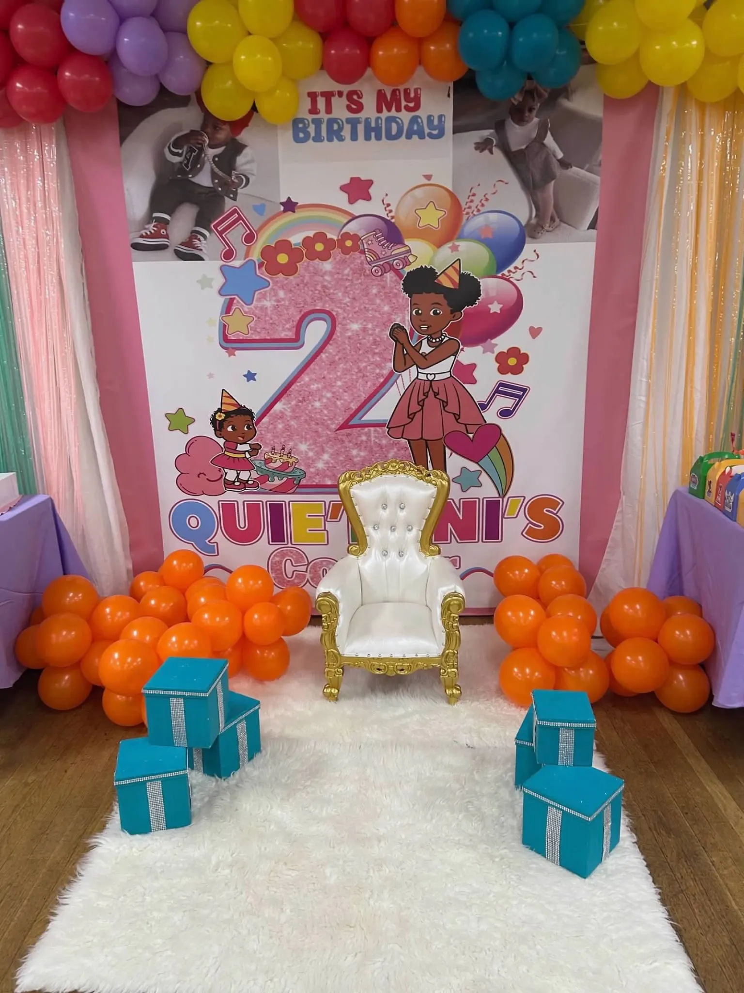 Custom second birthday backdrop with white and gold throne chair