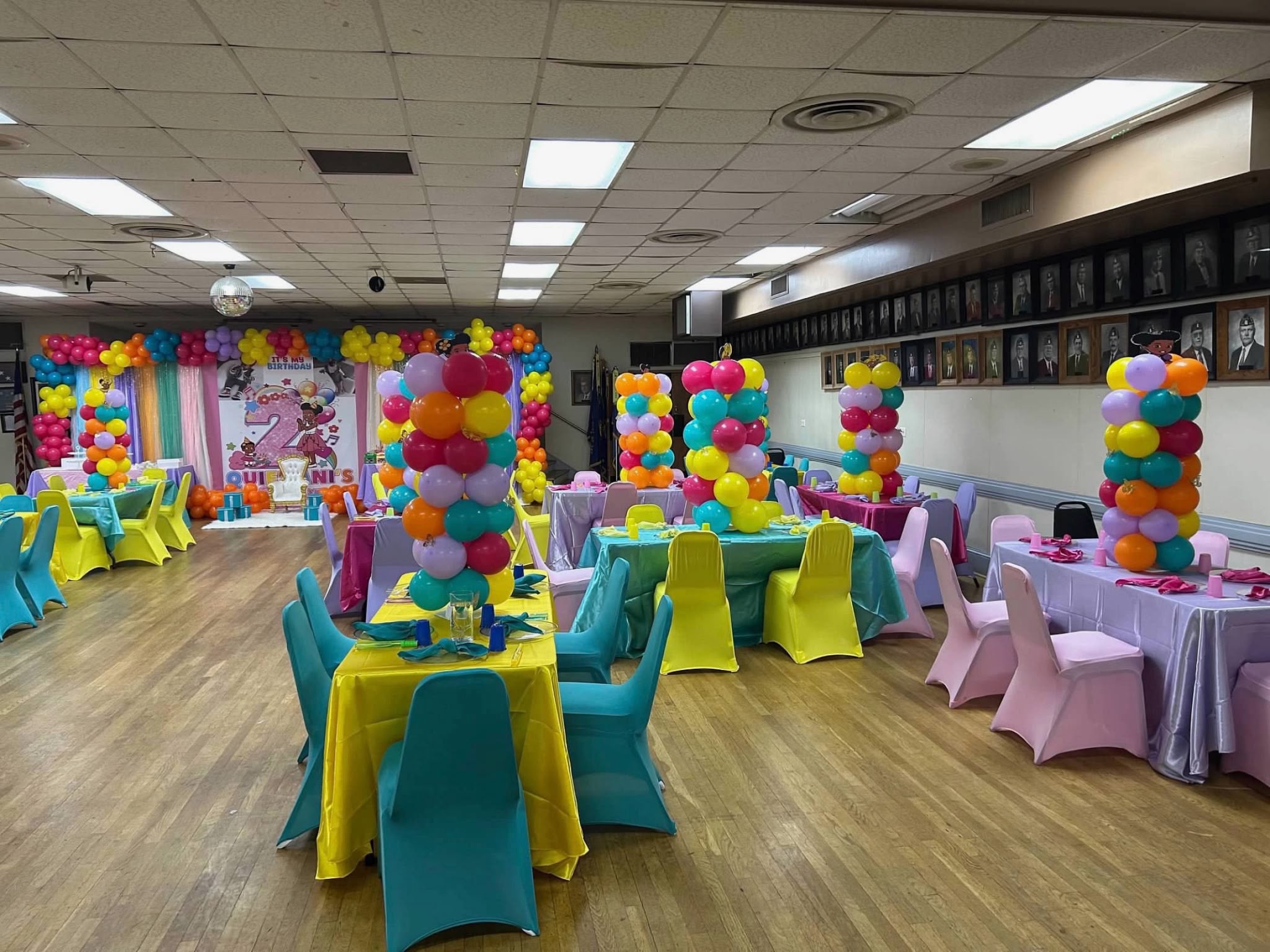 Wide view of the colorful second birthday room and balloon installations