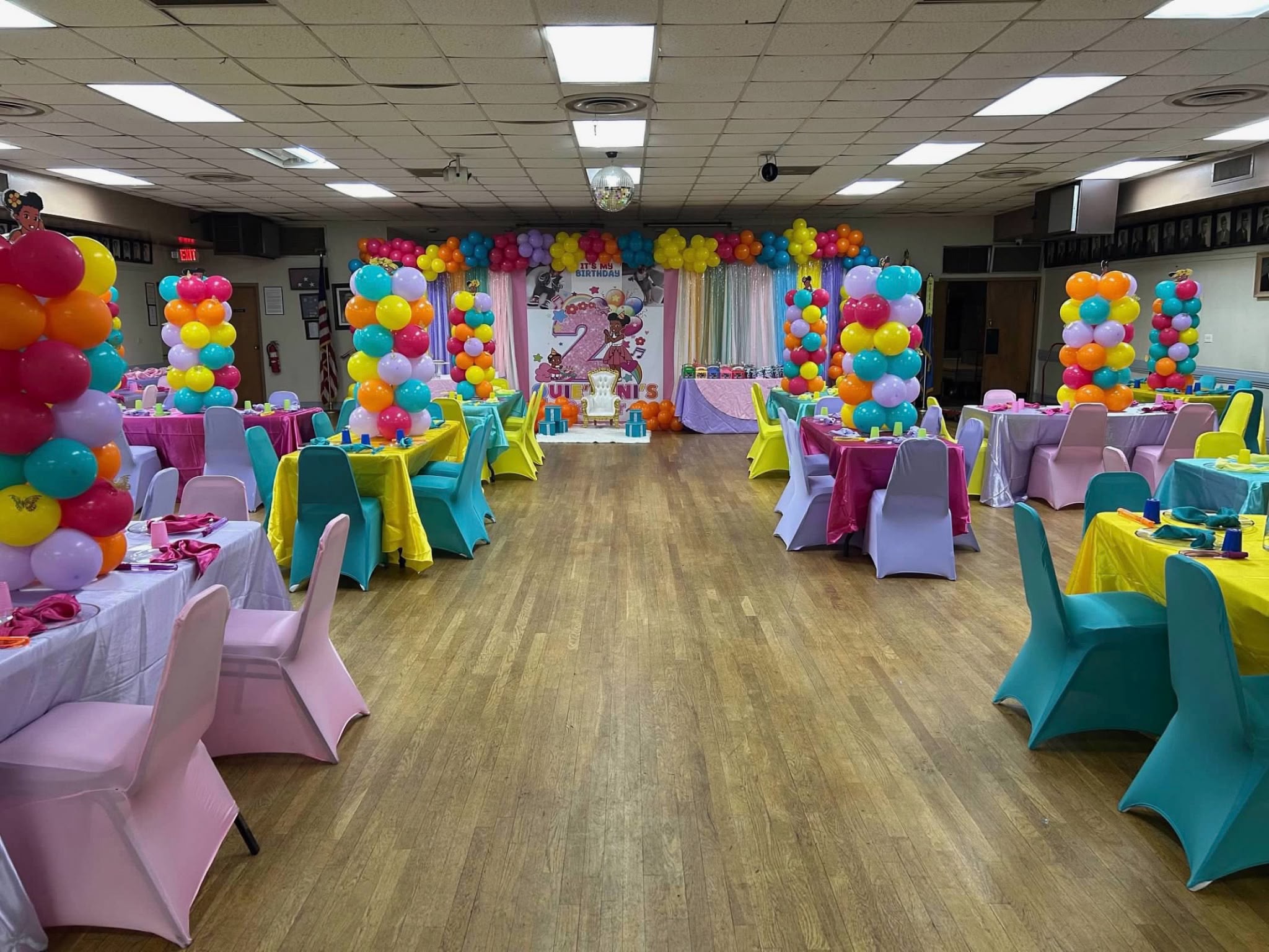 Centered wide view of the complete colorful birthday event room